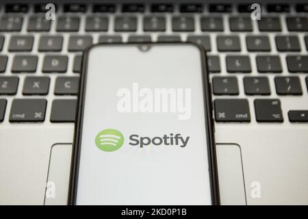 In this photo illustration a Spotify logo seen displayed on a smartphone screen with a computer keyword in the background in Athens, Greece on January 18, 2022. ( (Photo illustration by Nikolas Kokovlis/NurPhoto) Stock Photo
