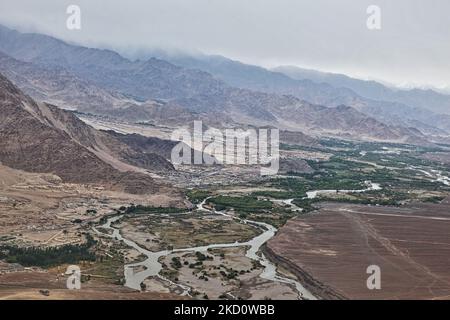 Rainclouds seen over the city of Leh, in Ladakh, India. The Indus River can be seen cutting thorough the mountainous landscape of the Trans-Himalayan High Altitude Desert. (Photo by Creative Touch Imaging Ltd./NurPhoto) Stock Photo