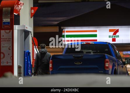 A man is filling up the car at the ESSO gas station in South Edmonton. On Thursday, January 20, 2021, in Edmonton, Alberta, Canada. (Photo by Artur Widak/NurPhoto) Stock Photo