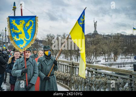 Nationalist march along the Paton bridge in Kiev during the celebrations of the Day of Unity in Ukraine. On January 22, 1919, an Act of Unification of Ukrainian lands into a single Ukraine was declared in Kyiv. (Photo by Celestino Arce/NurPhoto) Stock Photo