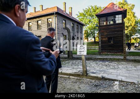 Visitors take pictures oh 'Halt!' sign in the former Nazi German Auschwitz I concentration camp at Auschwitz Memorial Site. Oswiecim, Poland on October 4, 2021. (Photo by Beata Zawrzel/NurPhoto) Stock Photo