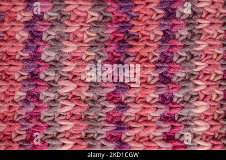 Handmade knitted background with detail wool threads. Stock Photo