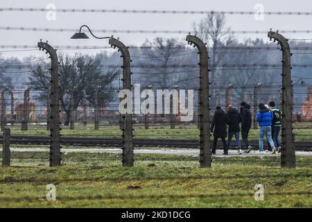 Visitors at the former Nazi-German Auschwitz II-Birkenau concentration and extermination camp in Brzezinka near Oswiecim, Poland on January 27, 2022. (Photo by Beata Zawrzel/NurPhoto) Stock Photo