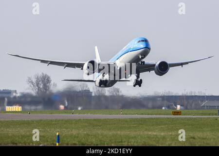 KLM Royal Dutch Airlines Boeing 787-10 Dreamliner aircraft as seen during the takeoff and flying in the blue sky, departing from Amsterdam Schiphol AMS EHAM airport. The modern wide body jet airplane has the registration PH-BKF and the name Sneeuwklokje / Snowdrop. KLM Koninklijke Luchtvaart Maatschappij is the Dutch flag carrier airline, the oldest operating airline in the world with a fleed of 149 jet planes, part of Air France - KLM group and member of SkyTeam aviation alliance group. The aviation industry and passenger traffic are phasing a difficult period with the Covid-19 coronavirus pa Stock Photo