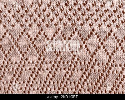 Beige Texture Knitted Fabric. Warm Wool Print. Knitwear Detail Background. Woven Fabrics. Scandinavian Macro Wallpaper. Organic Cotton Thread. Abstrac Stock Photo