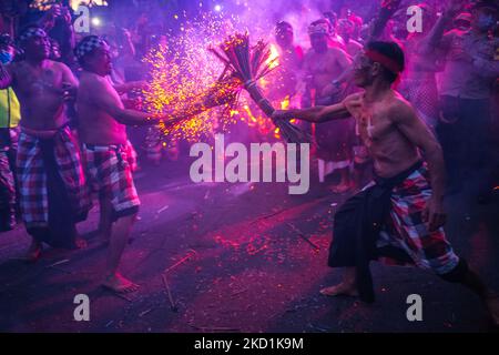 The indigenous people of Duda village, Bali, Indonesia held a fire war ritual to neutralize all the negative elements in the village, on Monday, January 31, 2022. The ritual that is held once a year, carries fire as a symbol of emotion in humans that must be controlled to get a harmonious life. (Photo by Keyza Widiatmika/NurPhoto) Stock Photo