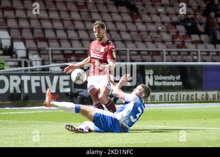 Northampton Town's Jack Sowerby is tackled by Barrow's John Rooney during the first half of the Sky Bet League 2 match between Northampton Town and Barrow at the PTS Academy Stadium, Northampton on Tuesday 1st February 2022. (Photo by John Cripps/MI News/NurPhoto) Stock Photo