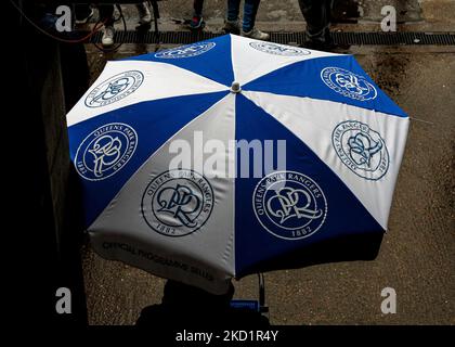 London, UK. 05th Nov, 2022. 5th November 2022; The Kiyan Prince Foundation Stadium, London, England; English Football League Championship Football, Queen Park Rangers versus West Bromwich Albion; QPR umbrella as the rain falls Credit: Action Plus Sports Images/Alamy Live News Stock Photo