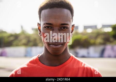 African football fan supporting his favorite team - Sport entertainment concept Stock Photo
