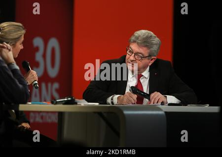 French leftist movement La France Insoumise (LFI) party's leader, MP and candidate for the 2022 French presidential election Jean-Luc Melenchon (R) speaks with French journalist and tv host Anne-Sophie Lapix (L) at the Abbe Pierre foundation in Paris, on February 2, 2022 during a conference on poor housing in France. (Photo by Michel Stoupak/NurPhoto) Stock Photo