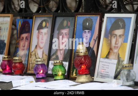 Photos of dead Ukrainian soldiers are seen during a rally of parents in front of the President's office in Kyiv, Ukraine 3 February 2022. Parents of Ukrainian soldiers who dead due to unstatutory relations and hazing during the service and in places of hostilities held their rally in front of the President's office in Kyiv, according to local media. (Photo by STR/NurPhoto) Stock Photo