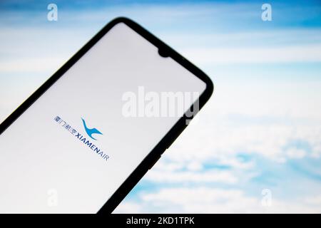 In this photo illustration a XiamenAir airlines logo seen displayed on a smartphone screen with a computer wallpaper in the background in Athens, Greece on February 4, 2022. (Photo Illustration by Nikolas Kokovlis/NurPhoto) Stock Photo