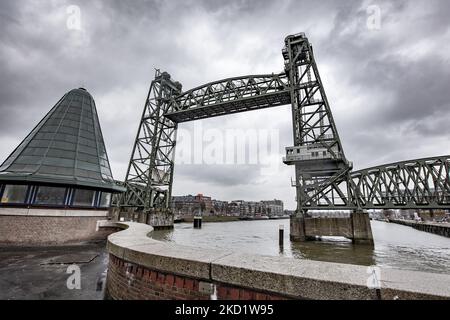 The iconic historic De Hef - Koningshavenbrug Bridge in the Dutch port city of Rotterdam may be dismantled for Jeff Bezos superyacht to pass under, as the mast of the sailboat exceeds the height of the bridge. The two-tower with swing lift bridge is an old level steel railroad bridge connecting the island, Noordereiland in the Maas river in the Southern part of Rotterdam. The bridge was built in 1877 and suffered damage during the 1940 German bombings. Since 2017 after the renovation work, the municipality promised that the bridge would never be dismantled again. The superyacht for the multibi Stock Photo