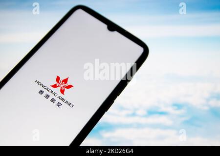 In this photo illustration a Hong Kong Airlines logo seen displayed on a smartphone screen with a computer wallpaper in the background in Athens, Greece on February 8, 2022. (Photo Illustration by Nikolas Kokovlis/NurPhoto) Stock Photo