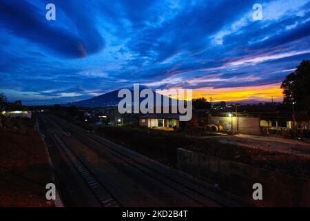 A view of Mount Salak during the sunset in Bogor, West Java, Indonesia, on February 10, 2022. (Photo by Adriana Adie/NurPhoto) Stock Photo