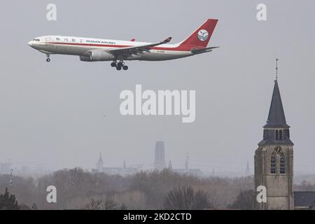 Sichuan Airlines Airbus A330-200F freight Cargo airplane as seen on final approach flying for landing on the runway of Brussels Airport Zaventem BRU in the Belgian capital. The Airbus 330F aircraft has the registration B-308P, the flight arrived from Moscow SVO and will continue to Chengdu CTU, China. Sichuan Airlines Co., Ltd. is a Chinese airline based in Chengdu Shuangliu International Airport in Chengdu, Sichuan Province, and is the largest airline in western China. The A330-200F is an all-cargo derivative of the A330-200 capable of carrying 65 t / 140,000 lb over 7,400 km / 4,000 nmi / 4, Stock Photo