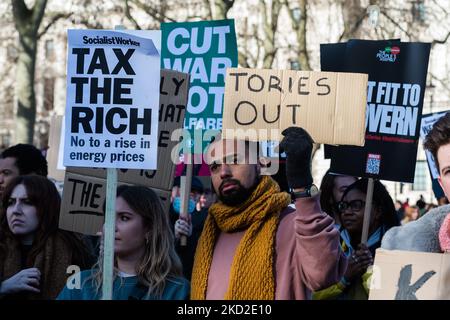 LONDON, UNITED KINGDOM - FEBRUARY 12, 2022: Demonstrators protest in Parliament Square against rising household energy bills, inflation-driven rise in prices and increase in National Insurance contribution amid stagnant wages calling on the government to act to tackle the cost of living crisis on February 12, 2022 in London, England. From April households across the UK will face a significant squeeze on their budgets as the energy price cap will increase by 54% due to global fuel and energy crisis and the National Insurace contribution will rise by 1.25 percent combined with high rates of infl Stock Photo