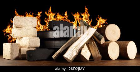 Firewood, Coal and Sawdust Briquettes - Compressed Wood Fire Logs isolated  on white Background Stock Photo - Alamy