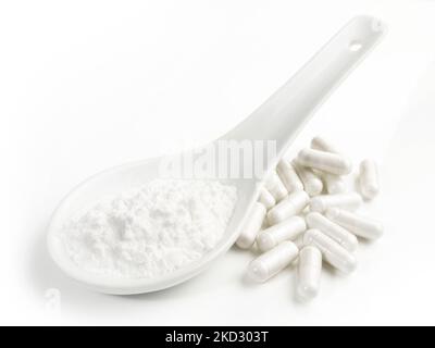 Manganese Powder with Capsules isolated  on white Background - Healthy Nutrition Stock Photo