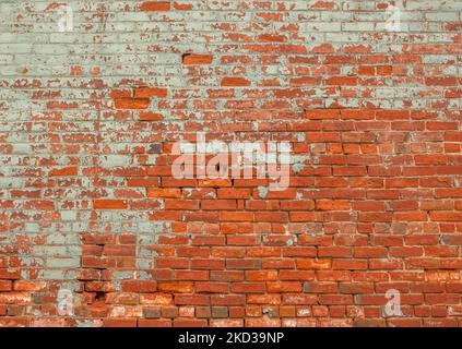 An old weathered brick wall on a historic building in Florence, Colorado. Stock Photo