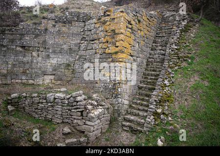 On 20 February, 2022, clouds hang over the ruins of the ancient city of Troy in Canakkale, Turkey. With a new bridge across the Dardanelles Strait nearing completion and inauguration, the region's historical ruins and many Gallipoli battle monuments will attract new visitors, tourism and trade routes to the area. (Photo by Diego Cupolo/NurPhoto) Stock Photo