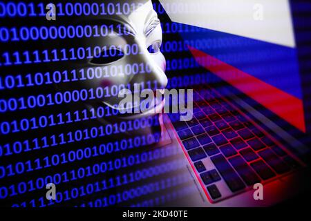 Russian flag displayed on a laptop screen, Guy Fawkes mask and binary code displayed on a screen are seen in this multiple exposure illustration photo taken in Krakow, Poland on March 1, 2022. Global hacker group Anonymous declared 'cyber war' against Russia. (Photo by Jakub Porzycki/NurPhoto) Stock Photo