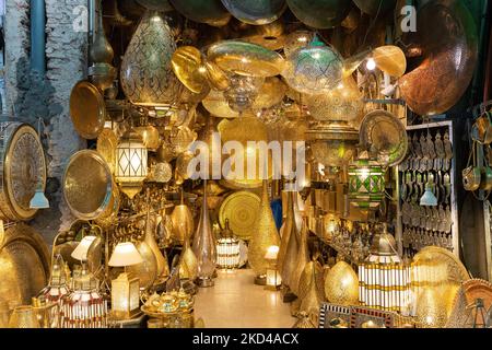 MARRAKESH, MOROCCO - 3RD NOV 22: A stunning copper and brass shop in the Medina and Souks of Marrakesh in Morocco. Selling lights and other decorative Stock Photo