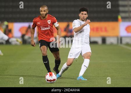 Murad Naji (12) of Al Wakrah on the ball as Yacine Brahimi (8) of Al Rayyan closes in during the Amir Cup quarter final between Al Rayyan and Al Wakrah at the Jassim Bin Hamad Stadium in Doha, Qatar on 5 March 2022. (Photo by Simon Holmes/NurPhoto) Stock Photo