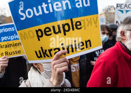 Several thousand people gathered in Paris to participate in a large march from Place de la République to Place de la Bastille to demand peace in Ukraine on the 10th day of the invasion of Russia. Many political figures and ordinary citizens marched amidst Ukrainian flags and slogans for peace and against Putin, in Paris on March 5, 2022. (Photo by Samuel Boivin/NurPhoto) Stock Photo