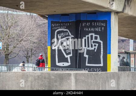 Mural presenting ussian soldier shaped as n SS German Nazi soldier and clenched fist with inscription - Stay strong Ukraine, and Putin = Hitler = Dead man is seen in Gdansk, Poland on 6 March 2022 The mural was created to support Ukrainian people during the Russian war against Ukraine. (Photo by Michal Fludra/NurPhoto) Stock Photo