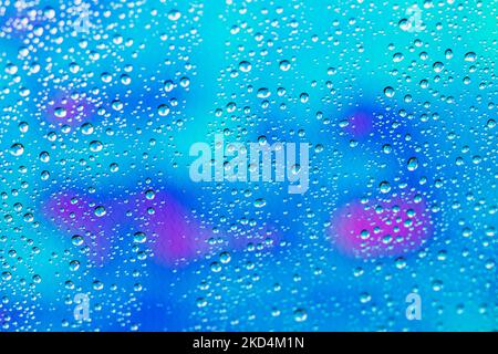 Raindrops on glass; colorful background; Seward; Alaska; USA Stock Photo