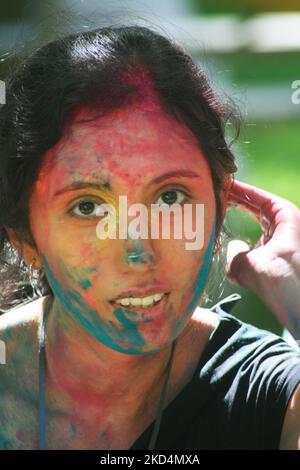 South Asian youth covered in colour celebrate during the Hindu festival of Holi in Brampton, Ontario, Canada. Though outside of India, Canada's South Asian population strive hard to keep their youth connected to their culture and heritage. Holi the religious festival of colours heralds the beginning of spring and is celebrated by Hindus across the world. The tradition of Holi, also known as Festival of Colours, heralds the beginning of spring and is celebrated all over India. During Holi it is customary to apply coloured powder to each other as part of the fun and celebration. Holi is celebrat Stock Photo