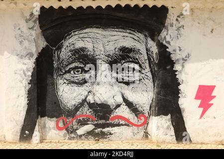 Street Art. Close up of a old mans face on a mural in old town Lagos, Algarve, Portugal Stock Photo