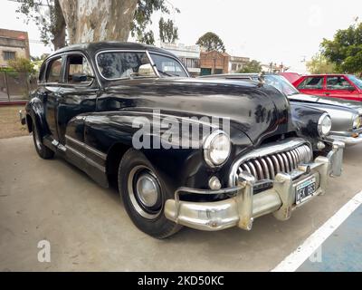 Old black 1940s Buick Eight Special four door sedan by GM in a park. AAA 2022 classic car show. Stock Photo