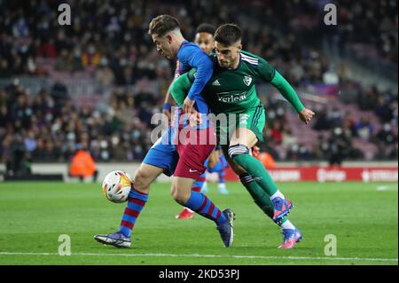 Nacho Vidal and Gavi during the match between FC Barcelona and CA Osasuna, corresponding to the week 28 of the Liga Santander, played at the Camp Nou Stadium, in Barcelona, on 13th March 2022. (Photo by Joan Valls/Urbanandsport /NurPhoto) Stock Photo