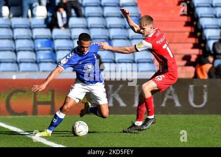 Oldham Athletic's Jordan Clarke tussles with Kieran Phillips during the Sky Bet League 2 match between Oldham Athletic and Exeter City at Boundary Park, Oldham on Saturday 19th March 2022. (Photo by Eddie Garvey/MI News/NurPhoto) Stock Photo