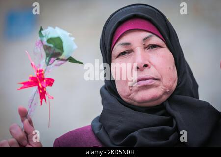 Mothers of Palestinian prisoners carry roses on International Mother's Day during a stand in solidarity with their sons in Israeli prisons(Photo by Momen Faiz/NurPhoto) Stock Photo