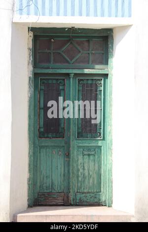 MERIDA, MEXICO - OCTOBER 2, 2016 a green bared door Stock Photo