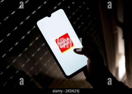 In this photo illustration a Wells Fargo logo seen displayed on a smartphone screen in Athens, Greece on March 25, 2022. (Photo by Nikolas Kokovlis/NurPhoto) Stock Photo