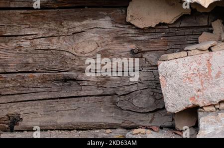 Old rotten wooden logs of abandoned house close up Stock Photo