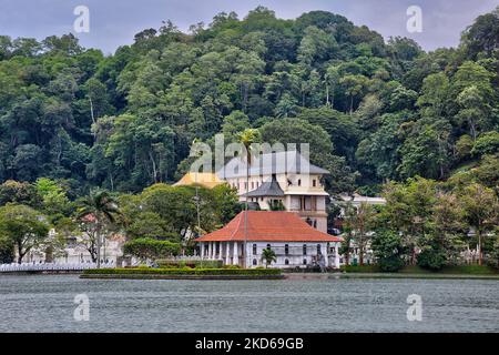 Temple of the Sacred Tooth Relic (Sri Dalada Maligawa) in Kandy, Sri Lanka. The Temple of the Sacred Tooth Relic is located in the royal palace complex of the former Kingdom of Kandy, which houses the relic of the tooth of the Buddha. Since ancient times, the relic has played an important role in local politics because it is believed that whoever holds the relic holds the governance of the country. (Photo by Creative Touch Imaging Ltd./NurPhoto) Stock Photo