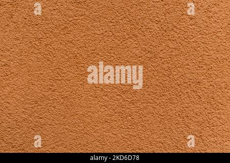 Texture of bright orange plastered and painted wall close-up Stock Photo