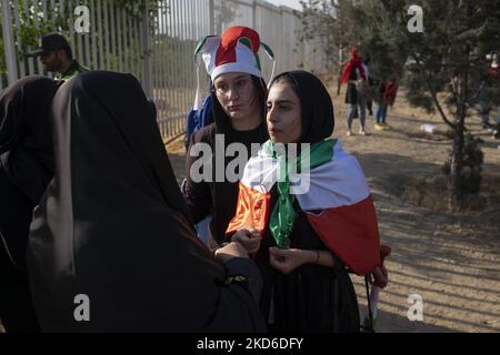 Two Iranian policewomen talk to soccer female fans just out of the Azadi (Freedom) stadium in western Tehran, October 10, 2019. Despite the Iranian sports ministry making tickets for Iranian female soccer fans for the March 29th match between Iran and Lebanon, they were denied entry, making the Iranian football federation fear they will be banned from the 2022 World Cup in Qatar. (Photo by Morteza Nikoubazl/NurPhoto) Stock Photo