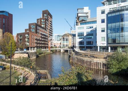 The Leeds railway station southern entrance, (at centre), opens on to the Granary Wharf & eeds Dock waterfront area Stock Photo