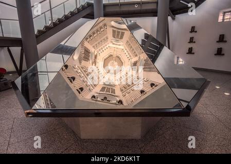 Reflections of the  displays  located on the sides of the tower at The Royal Armouries Museum in Leeds Yorkshire  ( & above the 'Hall of Steel'). Stock Photo