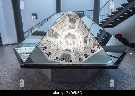 Reflections of the  displays  located on the sides of the tower at The Royal Armouries Museum in Leeds Yorkshire  ( & above the 'Hall of Steel'). Stock Photo