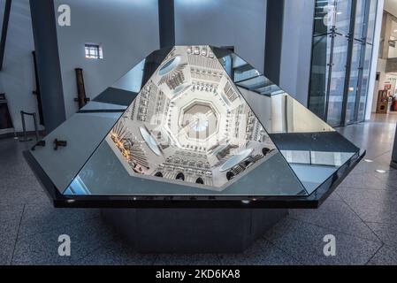 Reflections of the  displays  located on the sides of the tower at The Royal Armouries Museum in Leeds Yorkshire  ( & above the 'Hall of Steel'). Stock Photo