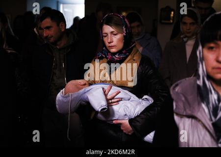 Russian woman in winter clothes against Orthodox monastery