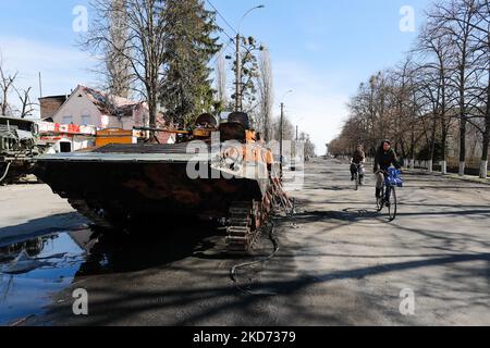 Cyclists are seen on the messy streets in Borodyanka , Bucha Raion of Kyiv Oblast, on 7 April 2022. (Photo by Ceng Shou Yi/NurPhoto) Stock Photo