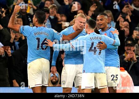 Manchester City's Erling Haaland (centre) celebrates scoring their side's second goal of the game with team-mates Rodrigo (left), Phil Foden and Manuel Akanji (right) during the Premier League match at the Etihad Stadium, Manchester. Picture date: Saturday November 5, 2022. Stock Photo